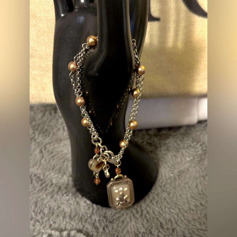Elegant Pearl and Silver Charm Bracelet